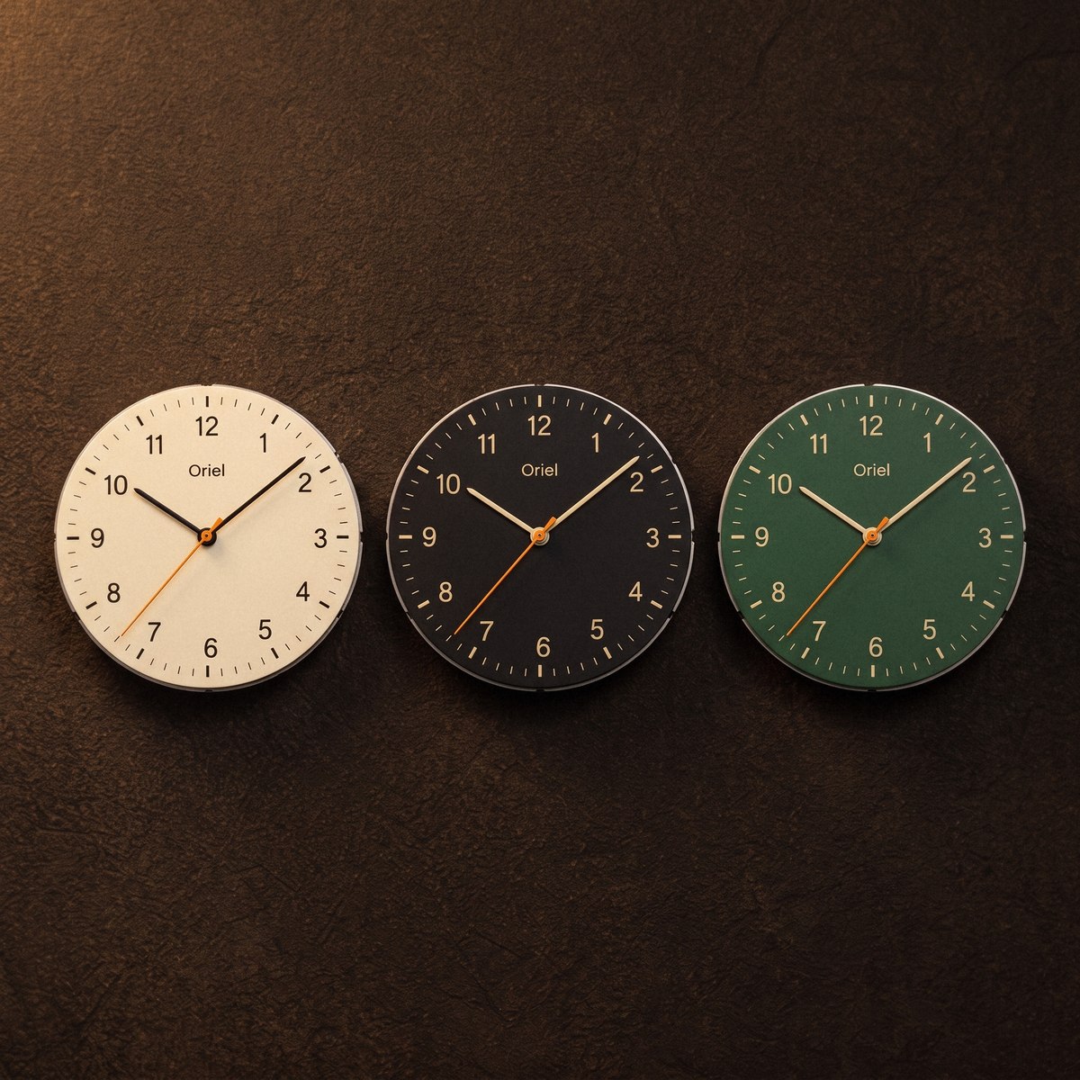 Three dial cartridges in a row on a dark ground: cream, black and green.